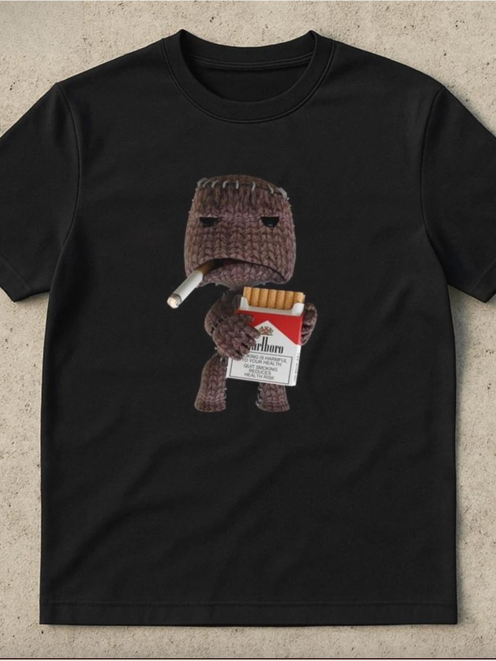 Gildan Black Graphic Tee with Sackboy Smoking and Cigarettes Print